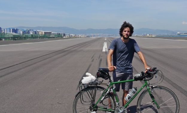 Jamie and bike on the runway in Gibraltar