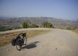 Dusty mountain road and bicycle, Morocco