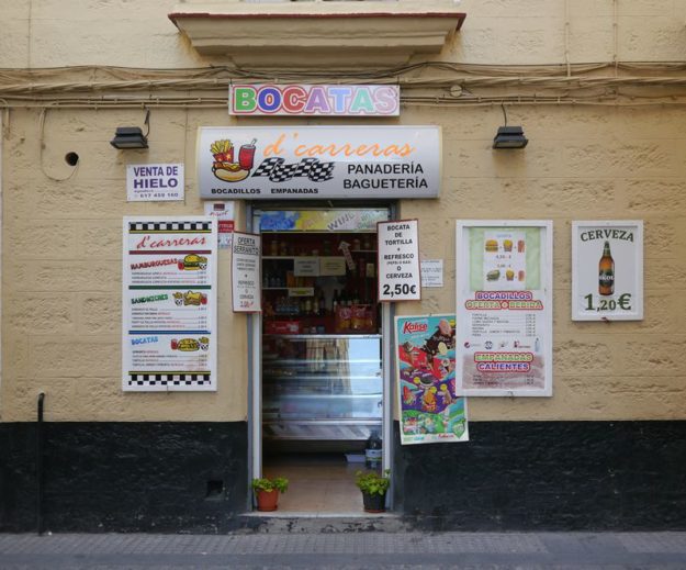 shop with signs in Cadiz