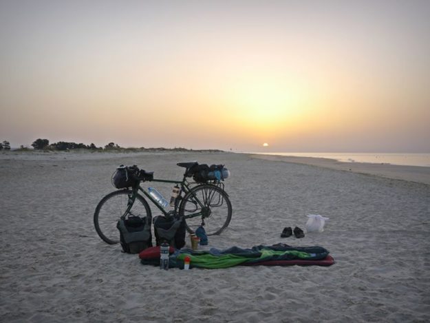 my bike and sleeping bag on a portugues beach