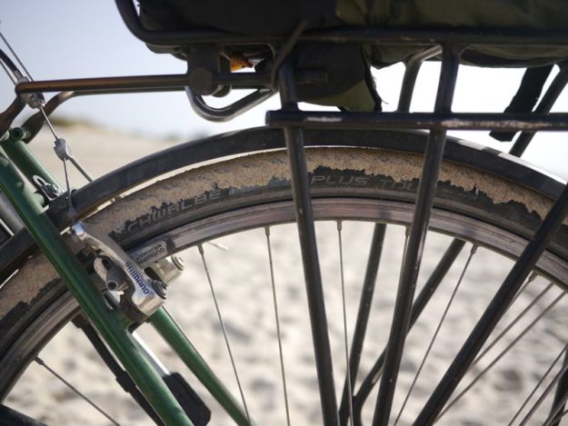 beach sand on bicycle tyre