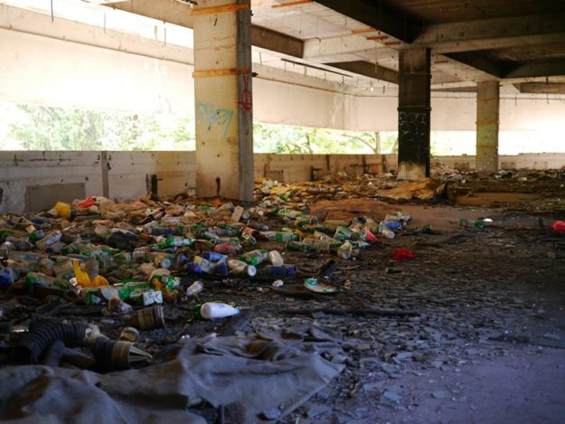 Trash lines the floor inside the tower.