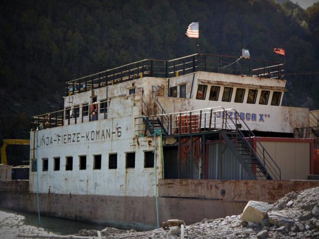 Old rusty boat at Fieraza with American flags
