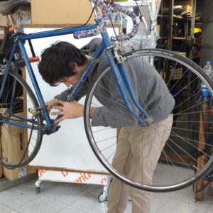 Repairing a road bicycle at bicycle co-op