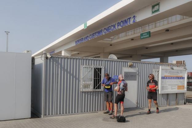 The lot of us buying tickets at Alat from the container ticket office