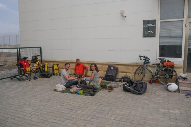 Sitting on the ground, waiting for the ferry to arrive