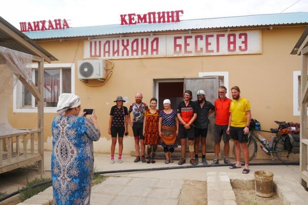 A woman takes a photo of us outside a chaihana in the Kazakh desert