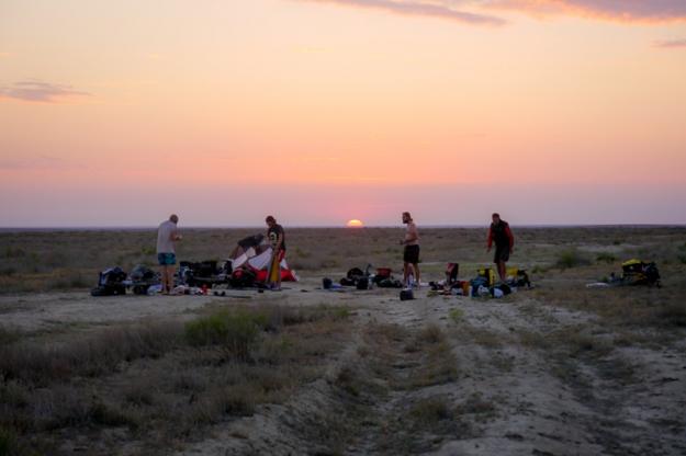 Packing up our stuff ready for another day of cycling. Sunrise across the plains.