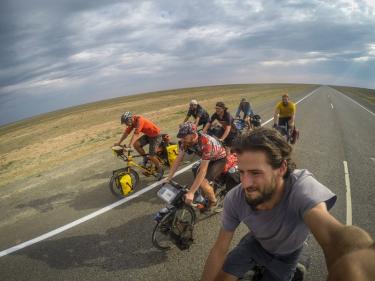 7 cyclists cycling the Kazakhstani desert. (the Kylylkum desert in Kazakhstan)