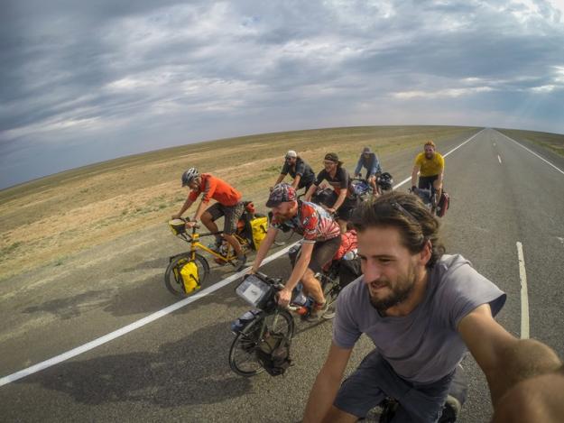 7 cyclists cycling the Kazakhstani desert. (the Kylylkum desert in Kazakhstan)