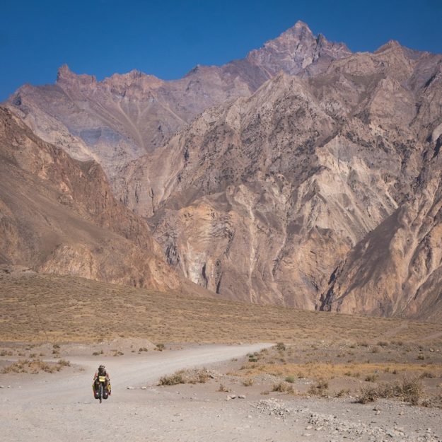 Cycling next to huge mountains in Tajikistan