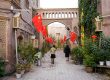 Fake paved roads, concret and Chinese flags in Kashgar